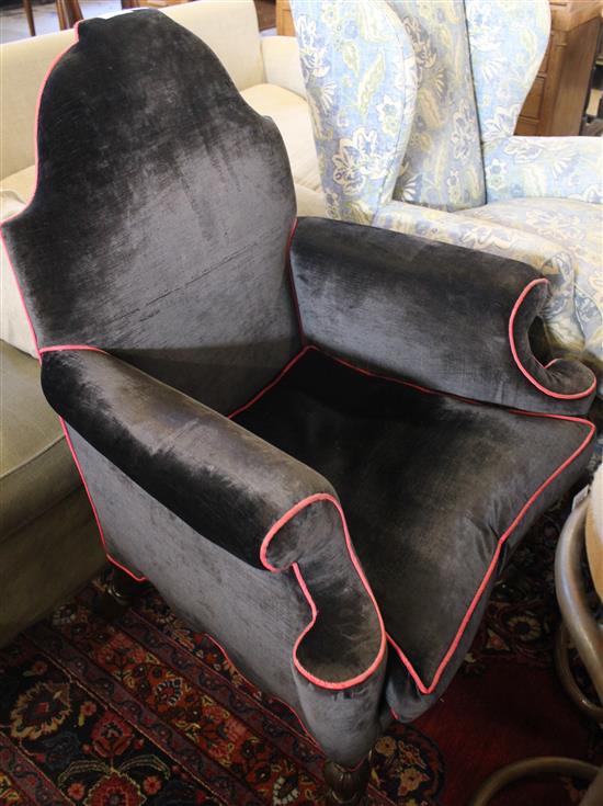 Black upholstered Queen Anne style armchair